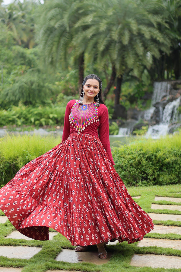 Festive Wear Printed Cotton With Kutchi Gamthi Work And 12 Meter Flair Maroon Color Navratri Gown